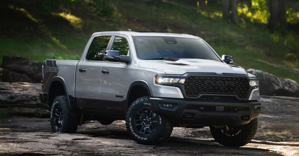 White pickup truck with rugged off-road tires.